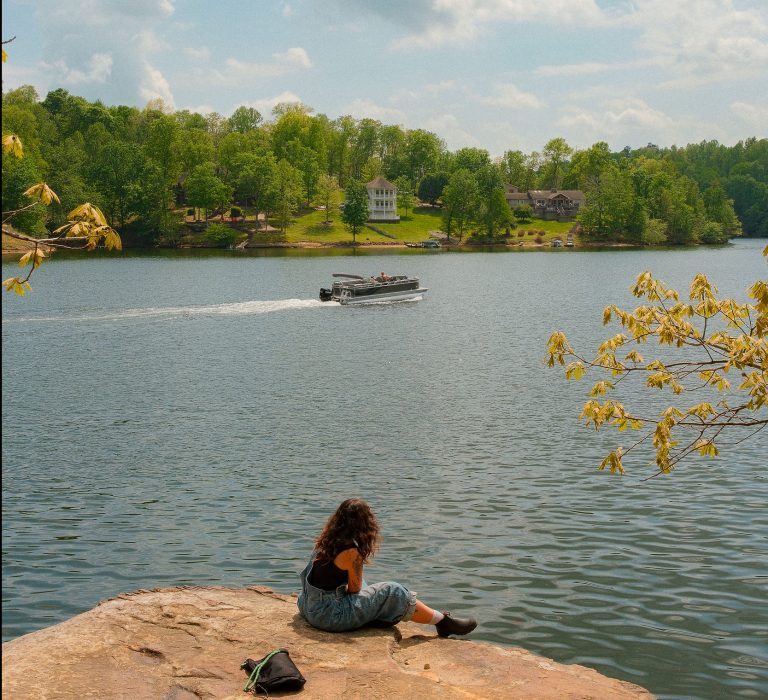 Girl Watching boat on Lake Malone
