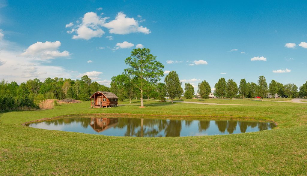 Cabin by Pond for family camping experience